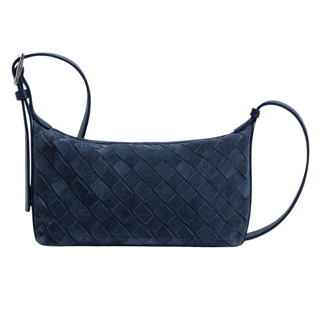 Navy blue woven handbag with a strap on a white background