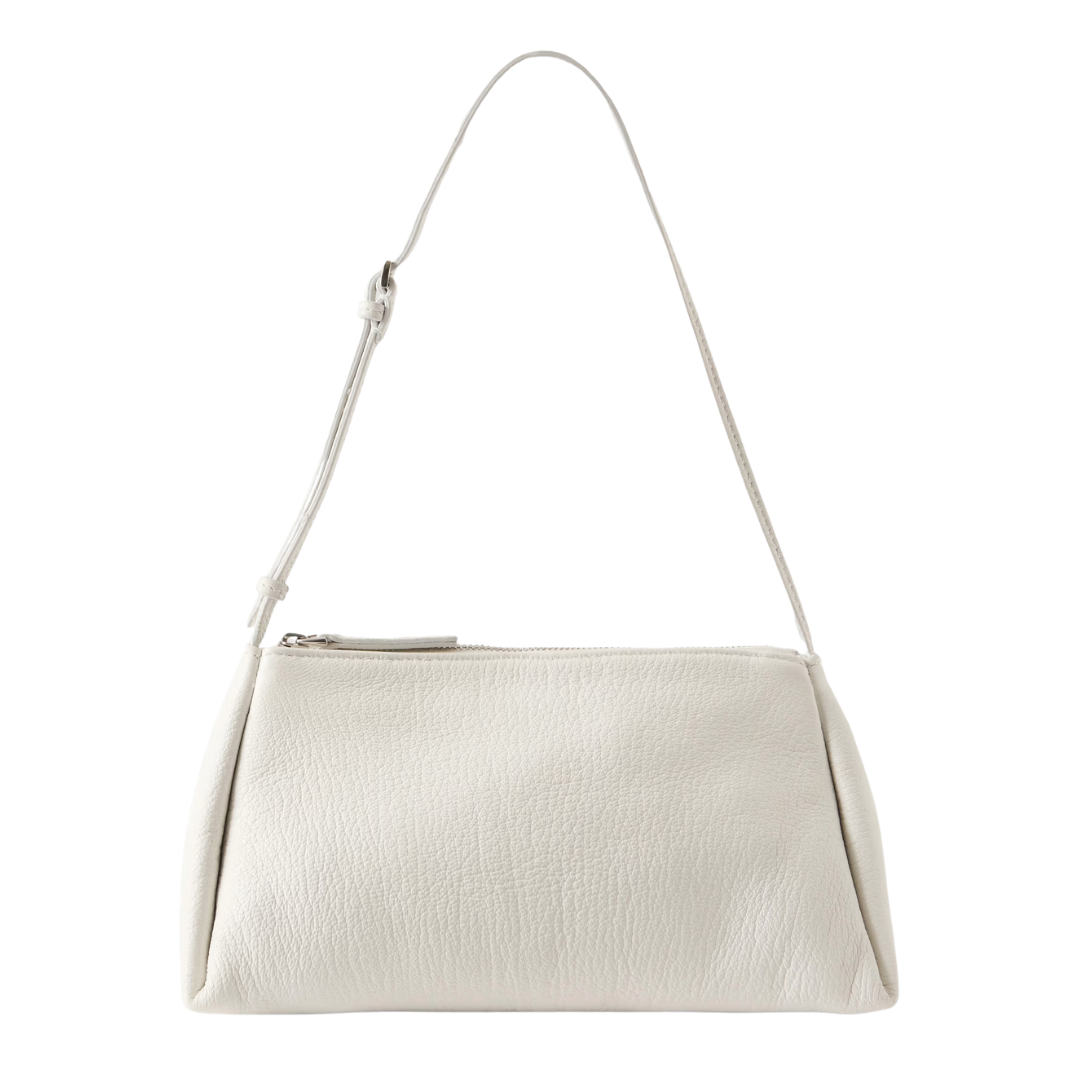 White handbag with a strap on a white background