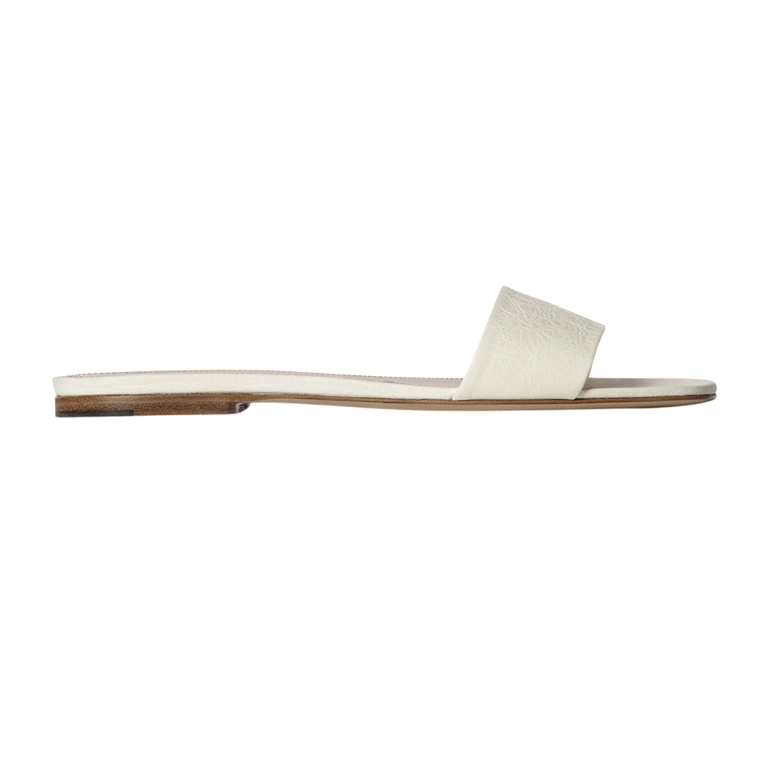 White sandal with wooden sole on a white background
