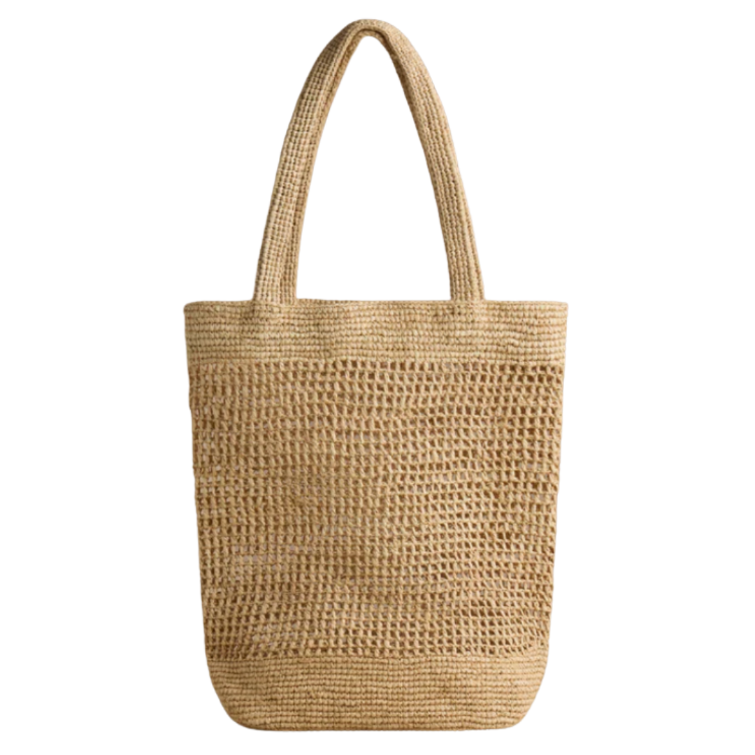 Woven straw tote bag on a white background