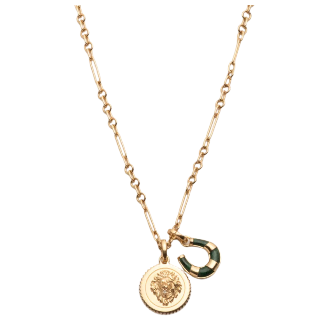 Gold necklace with two charms on a white background