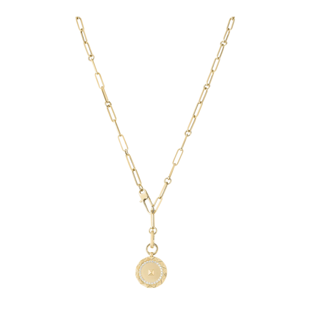 Gold necklace with a round pendant on a white background