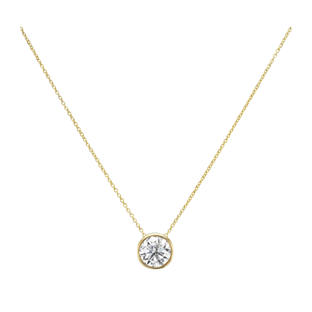 Gold necklace with a diamond pendant on a white background