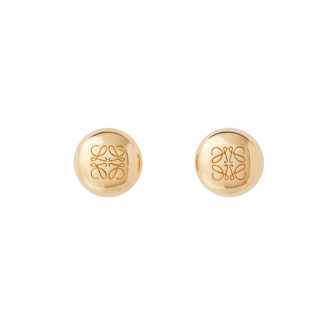 A pair of gold round stud earrings with an engraved Loewe anagram logo on a clean white background.