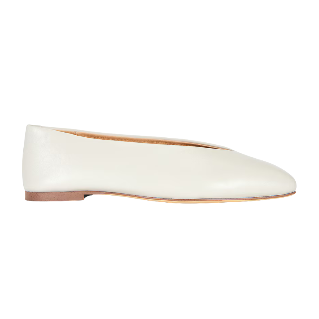 A single off-white leather ballet flat shoe shown in a side profile view against a solid white background.