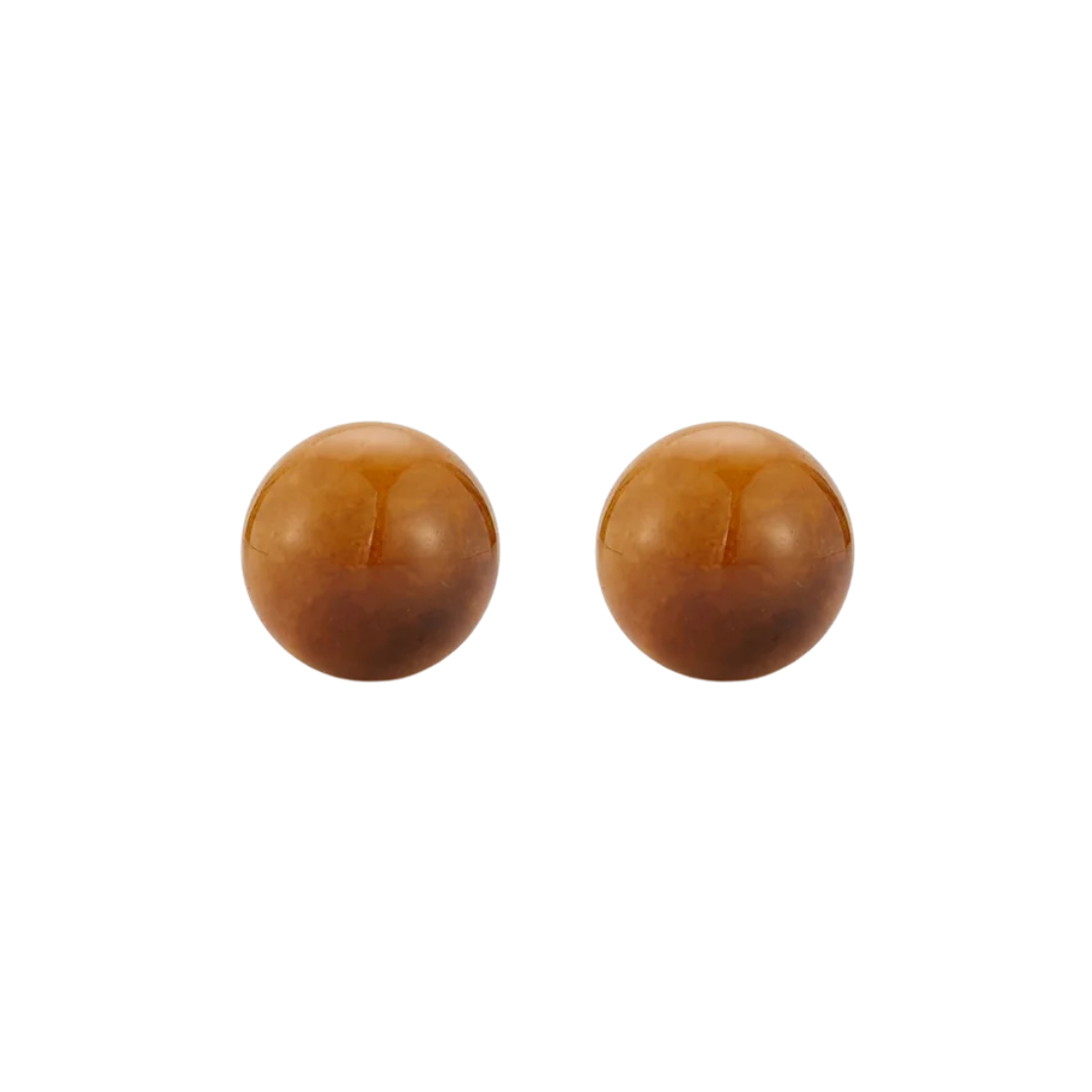 A pair of smooth, polished round brown beads on a plain white background.