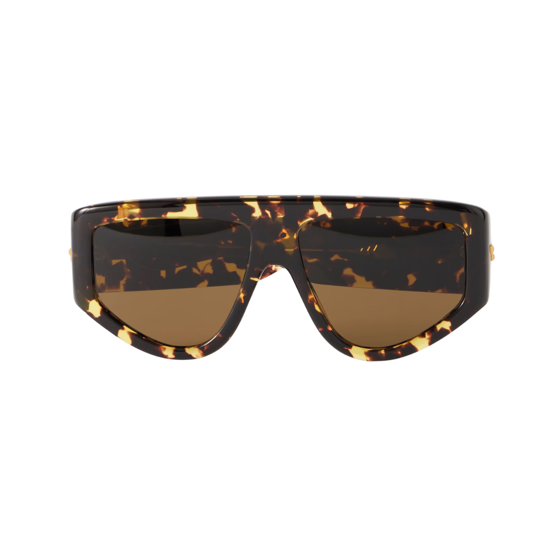 A pair of oversized shield-style sunglasses with a glossy tortoiseshell frame and brown tinted lenses, shown against a plain white background.