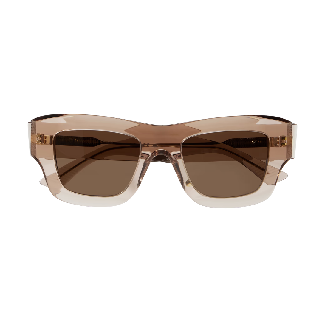 A pair of oversized square sunglasses with a translucent smoky brown frame and dark brown lenses, shown against a plain white background.