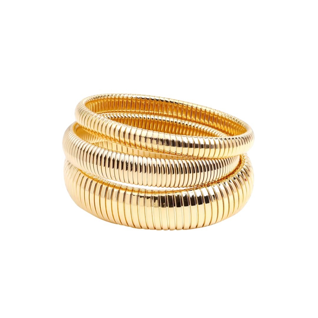 A stack of three gold-plated snake-skin bangles on a solid white background.